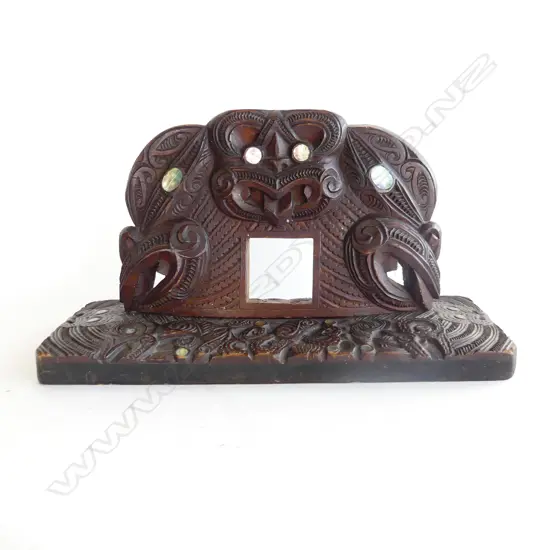 An old Māori well carved wood clock stand,